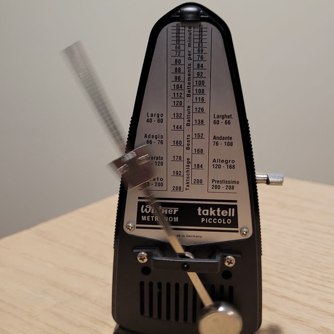 my metronome ticking at 152 beats per minute. photo of my metronome at home. a consistent and steady rythem, this one is slighly fast, but not anxiety inducing.